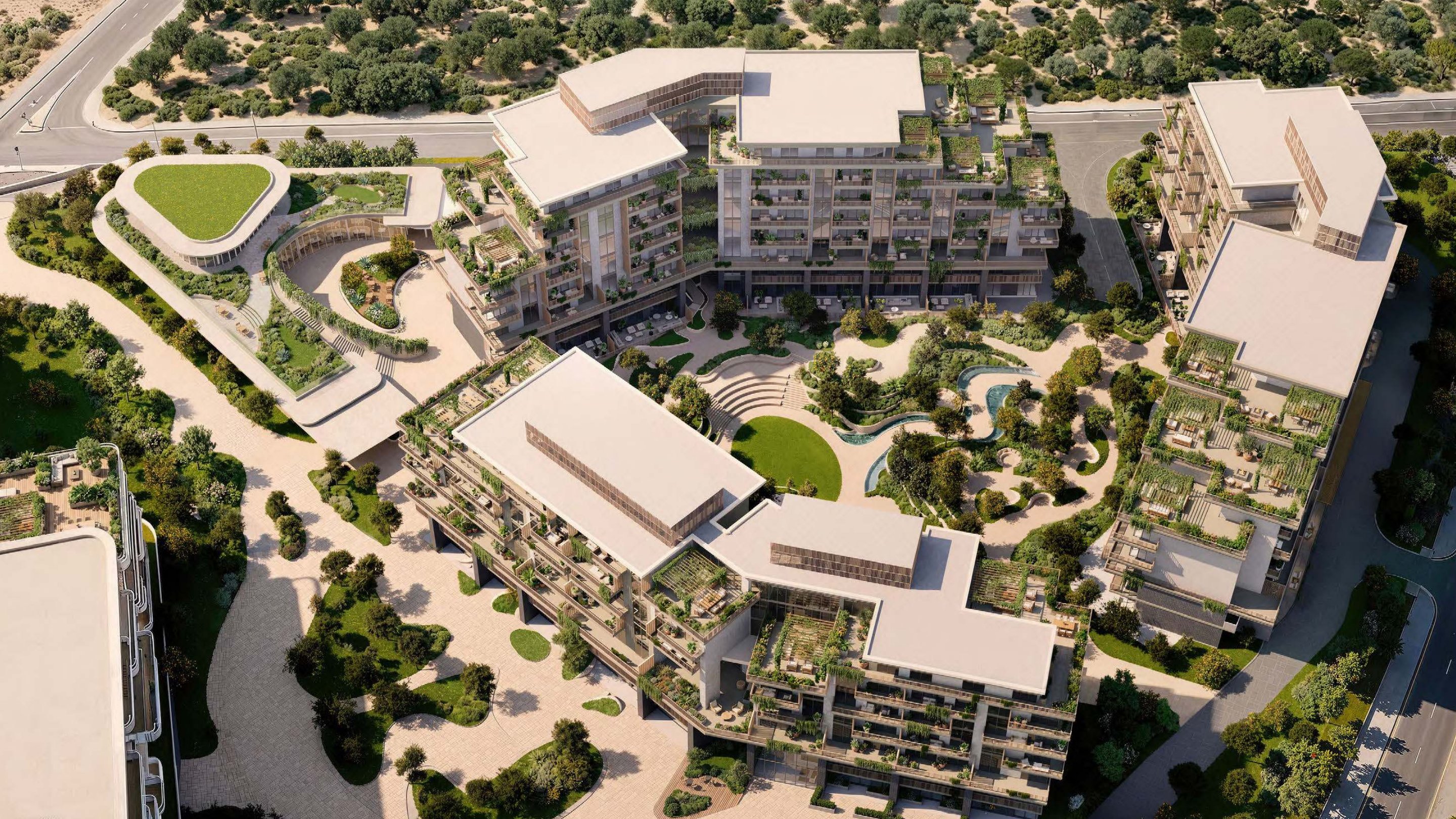 Arancia Yards aerial render — three low-rise buildings, central green valley, City of Arabia