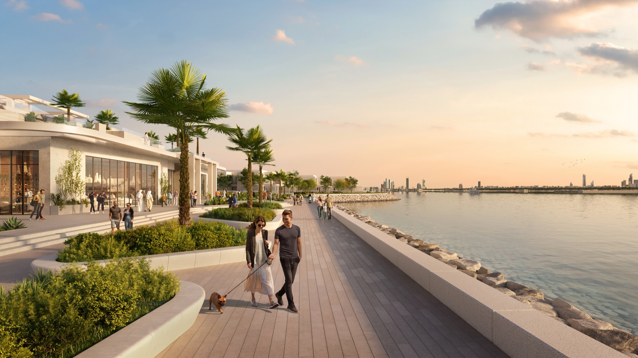Bashayer — sunset boardwalk with retail, palm trees and residents walking, Hudayriyat Island