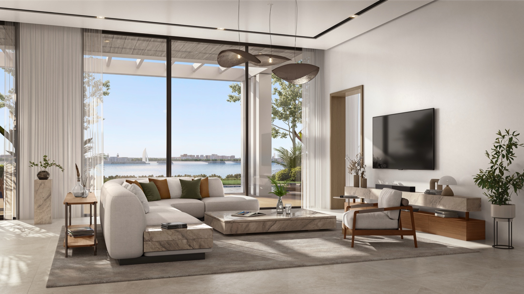 Bashayer Villas — living room opening onto the waterway with a sailboat passing