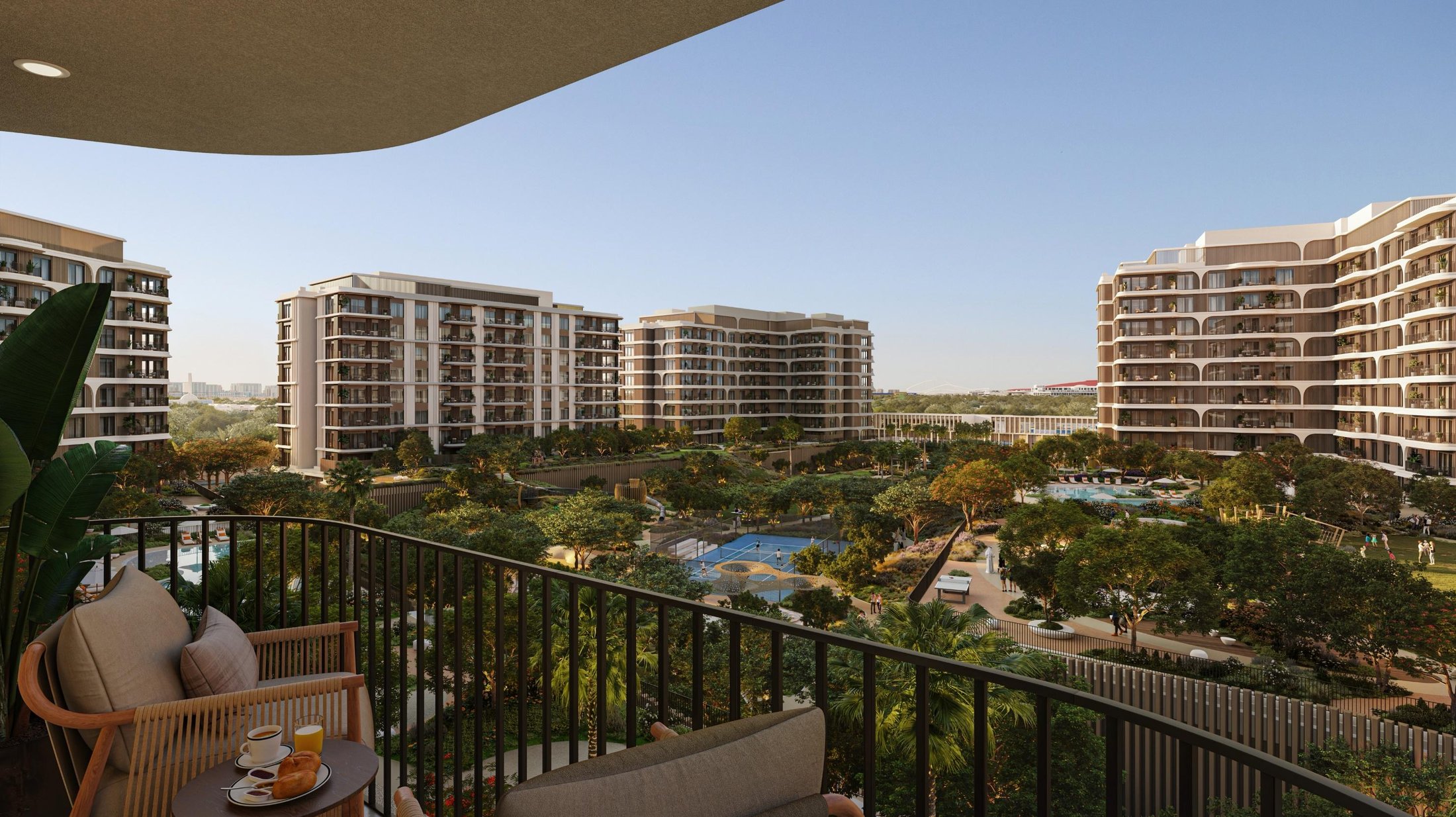 The Canopies at Yas Point — balcony view over central park, pools and padel courts