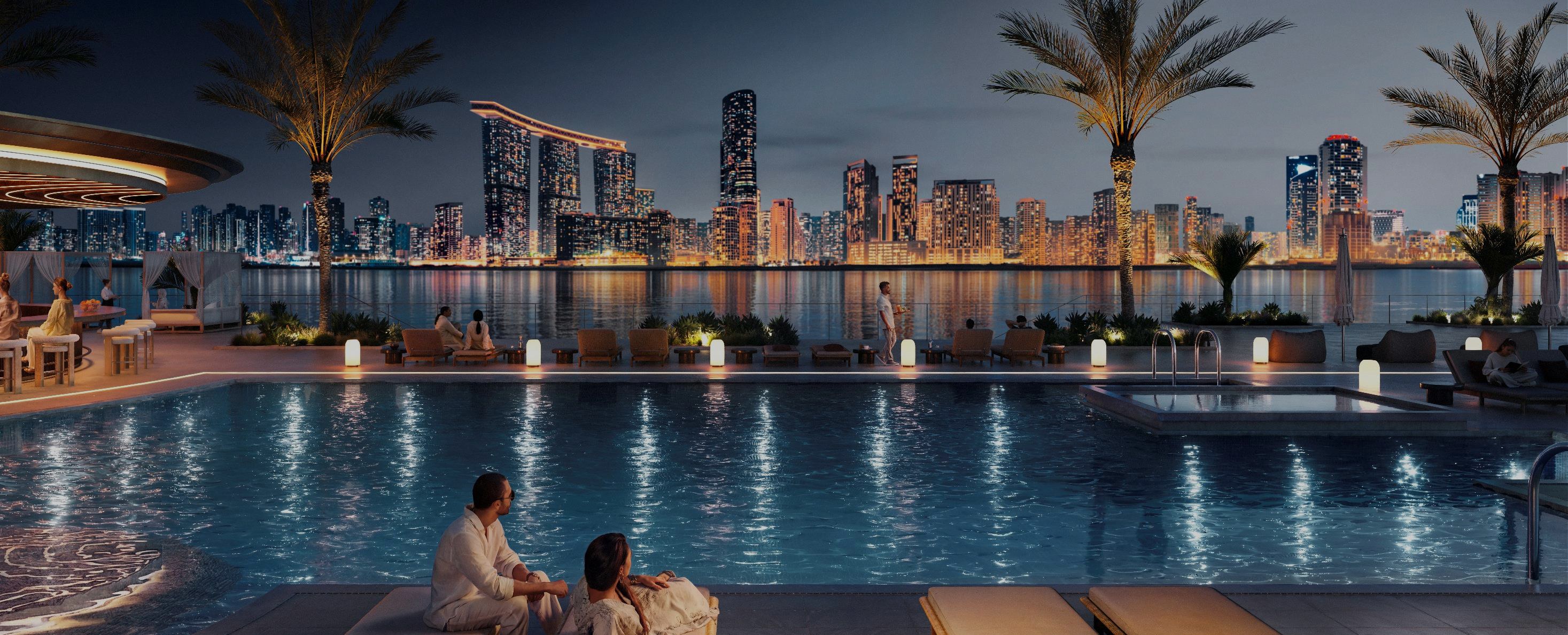 Marsa Al Saadiyat — night infinity pool overlooking the lit Abu Dhabi skyline