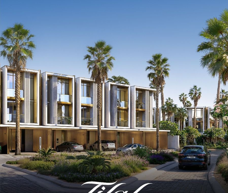 Tilal Binghatti — daytime view of villa façades framed by mature palms with private driveways